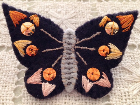 BUTTERFLY PIN (orange sequins) by artist Ulla Anobile