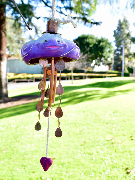 THROUGH RAIN OR SHINE by artists Chloe Kono (metalwork) and Randy Kono (sculpture)