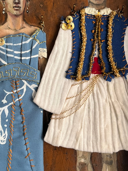 ATHENA AND NIKO by artists Athanasia Nancy Koutsouflakis (painting) and Elisa Cintron (fashion design)