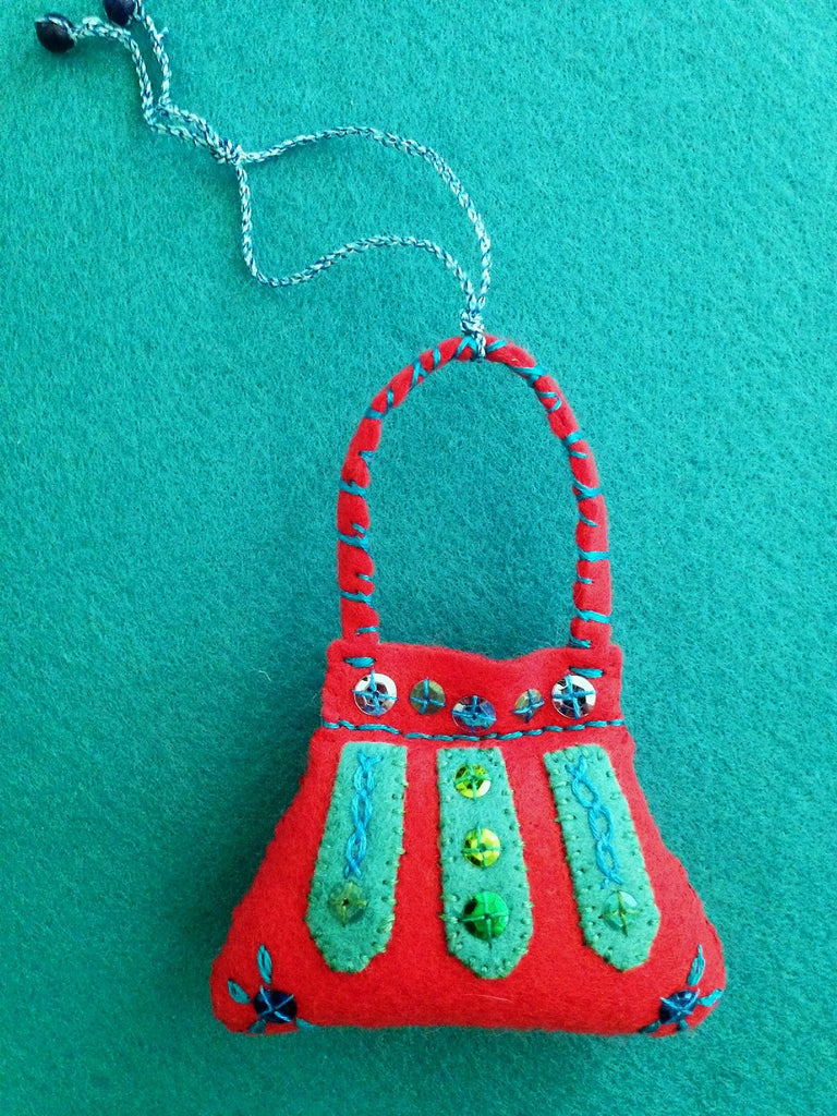 PURSE ORNAMENT, LIPSTICK RED WITH PERSIAN BLUE #5 by artist Ulla Anobile