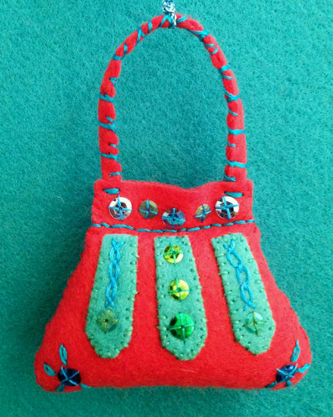 PURSE ORNAMENT, LIPSTICK RED WITH PERSIAN BLUE #5 by artist Ulla Anobile