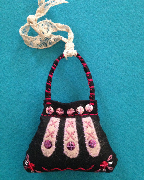 PURSE ORNAMENT, BLACK WITH OLD ROSE #1 by artist Ulla Anobile