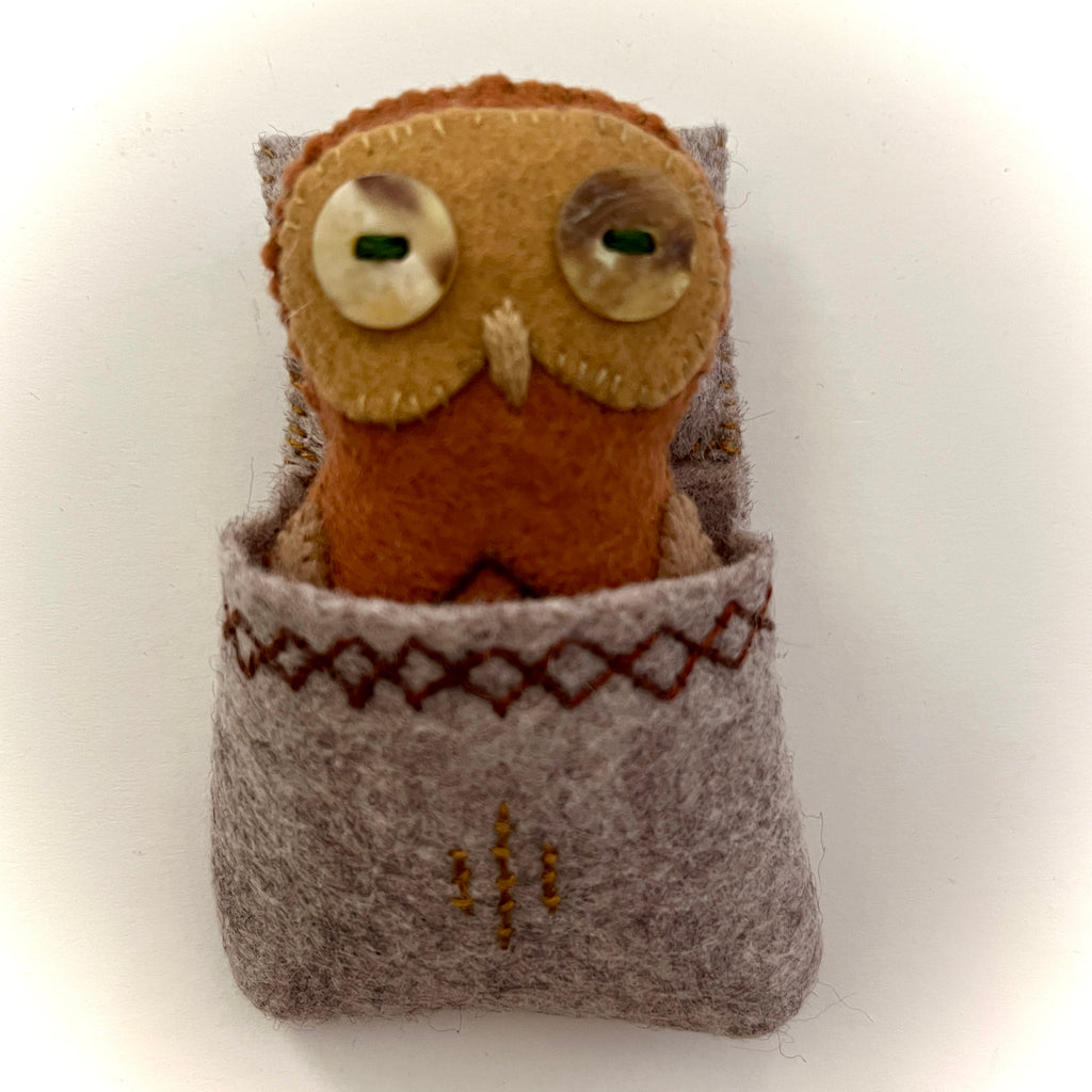 POCKET OWL 1 (with brown sleeping bag) by artist Ulla Anobile