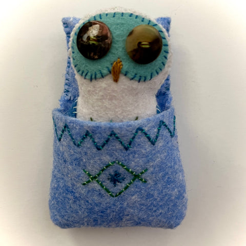 POCKET OWL 2 (with blue sleeping bag) by artist Ulla Anobile